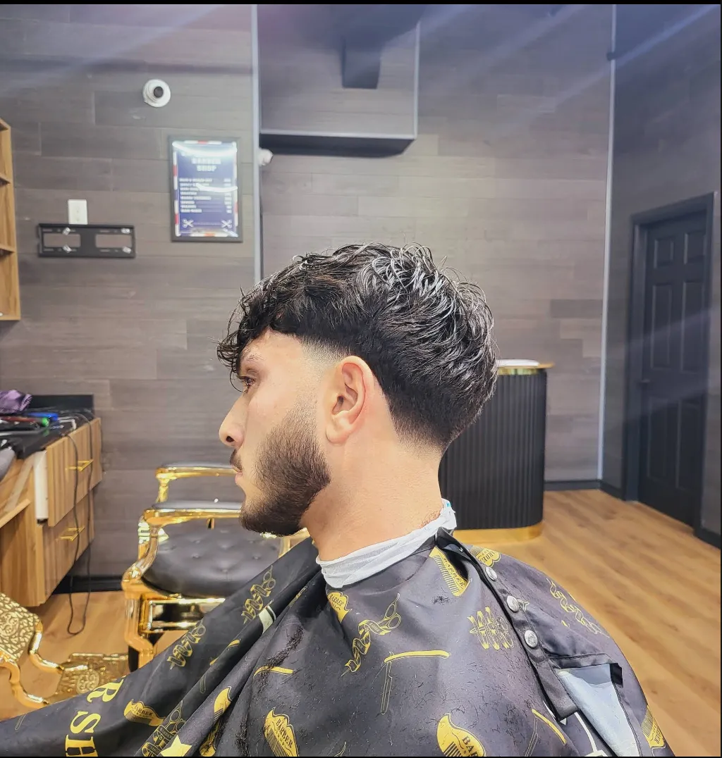 Fresh fade haircut result showing clean taper and defined shape at KS Ghost Barbershop