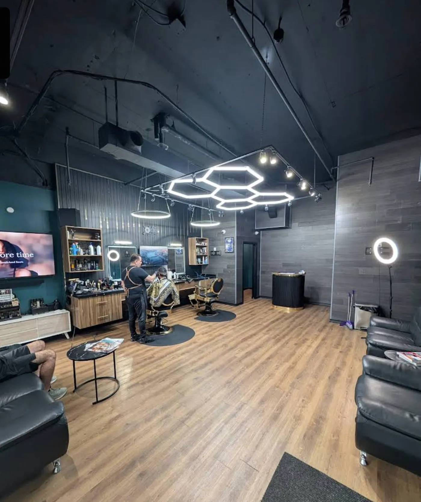KS Ghost Barbershop interior with hexagon LED lights and modern dark aesthetic